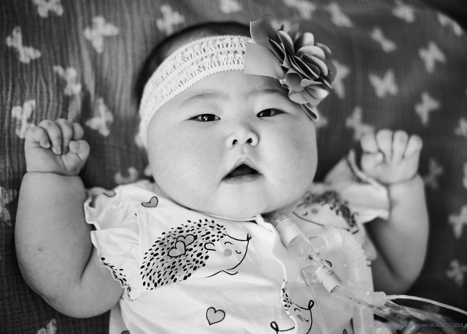 Black and white closeup of Constance staring